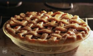 lattice topped pie baking in the oven