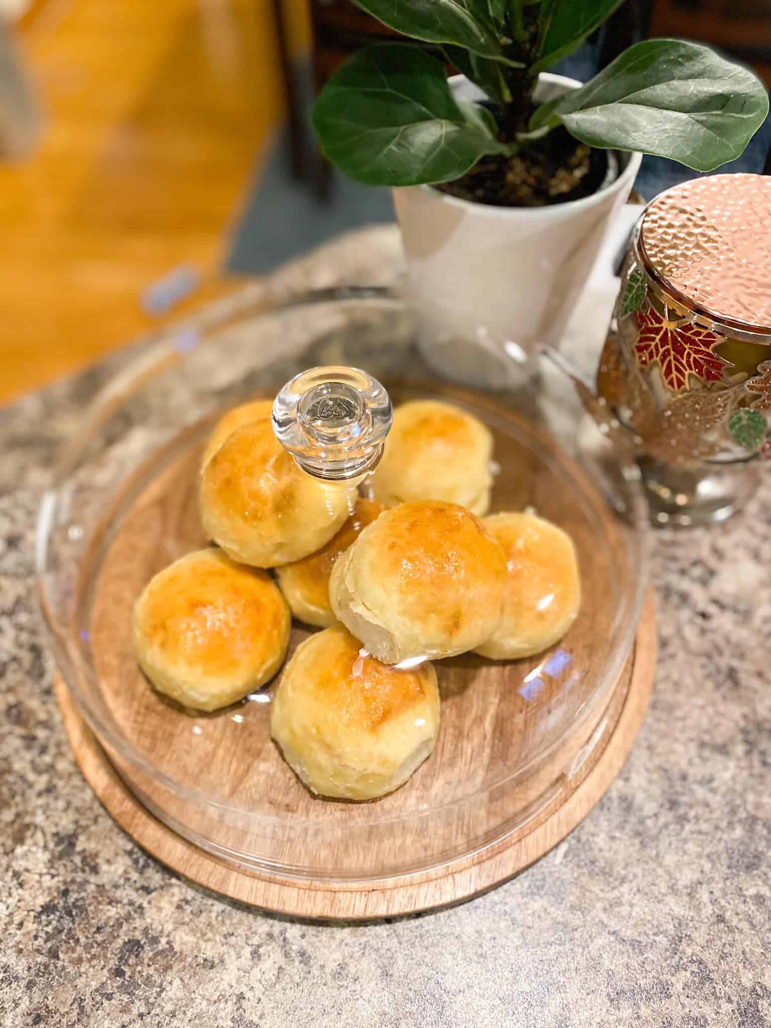 Dinner Rolls displayed under a clear dome