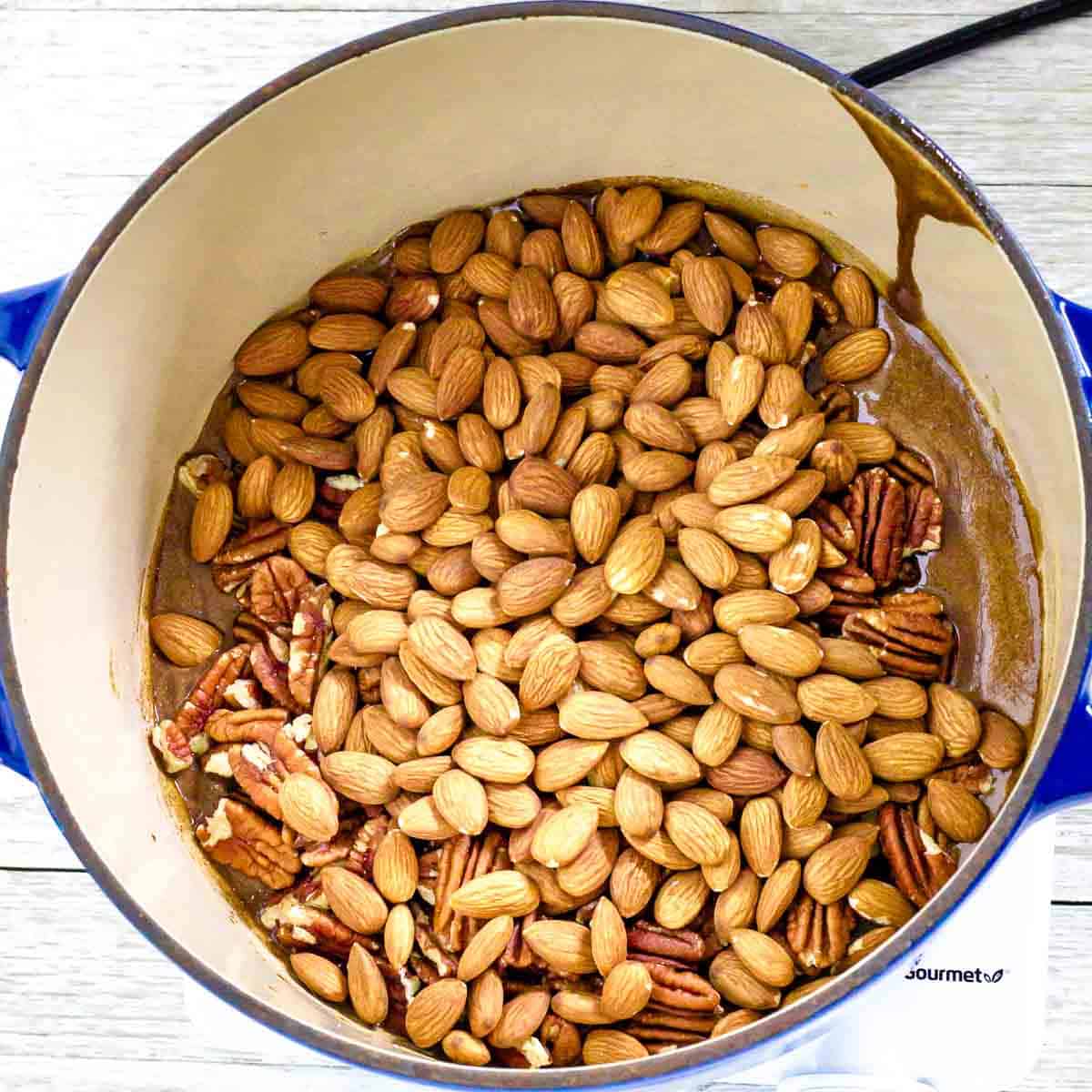 almonds and pecans poured into the pan
