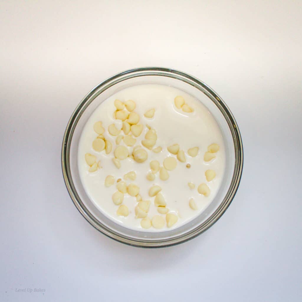cream and white chocolate chips in a bowl
