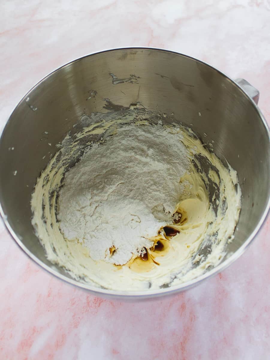 powdered sugar, vanilla and salt in the mixing bowl with cream cheese