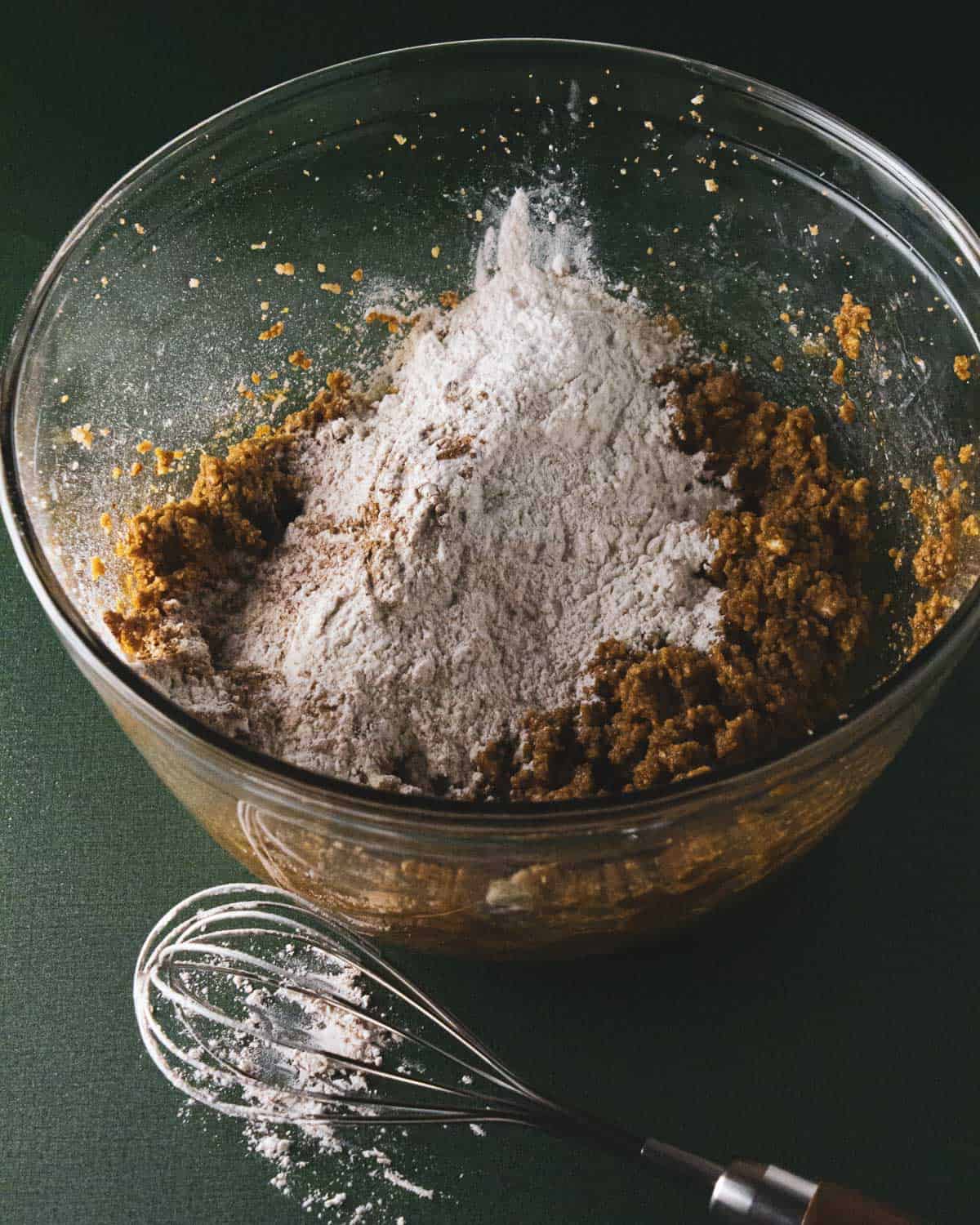 dry ingredients added to the cookie doughs glass mixing bowl