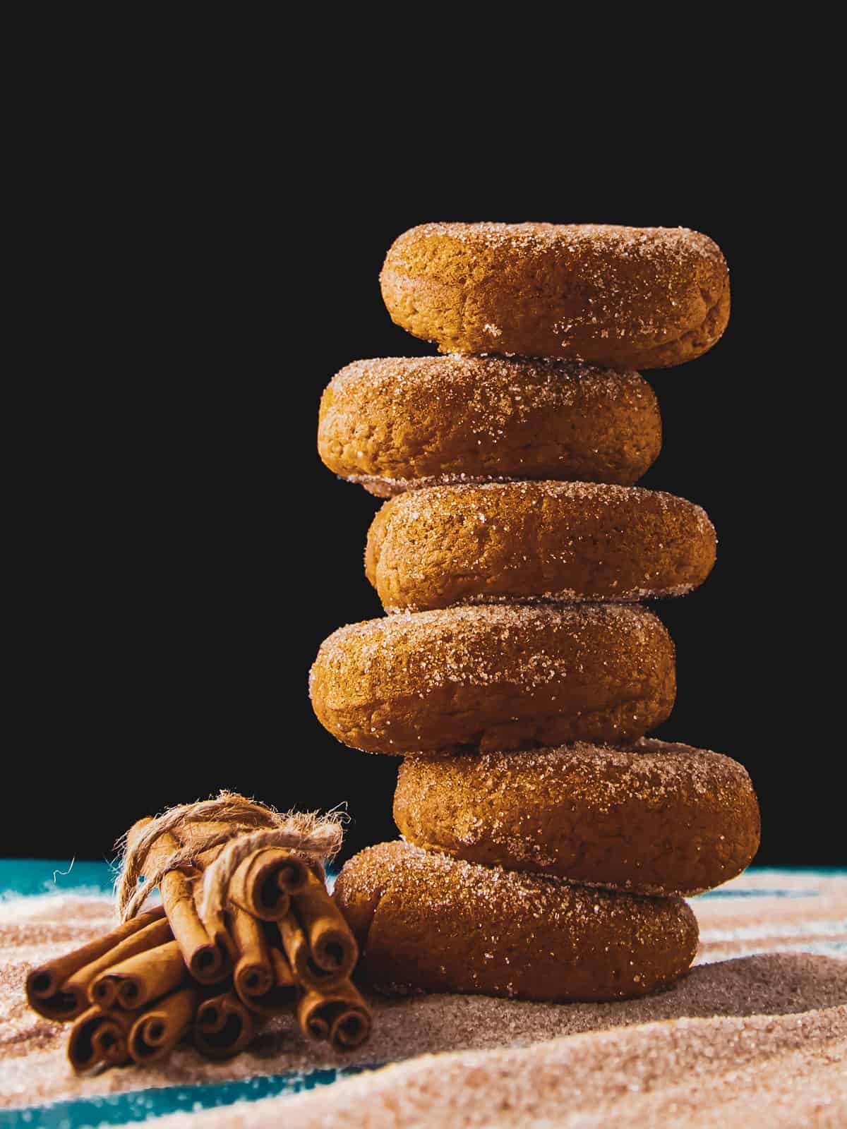 Tower of 6 cinnamon sugar topped pumpkin spice donuts.