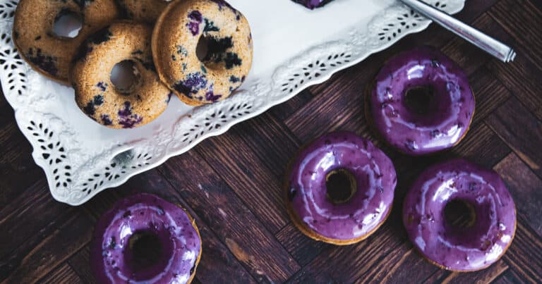 blueberry baked donuts with a blueberry glaze.