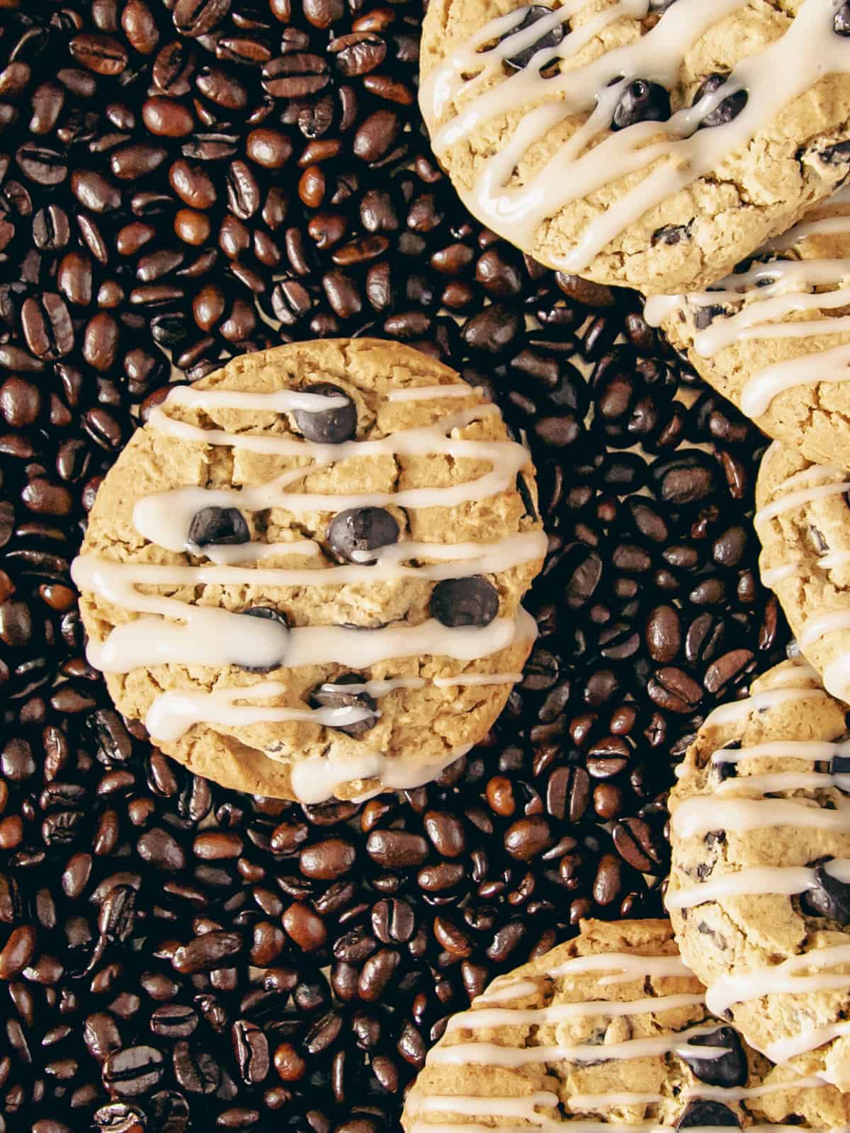 Coffee cookies surrounded by coffee beans.