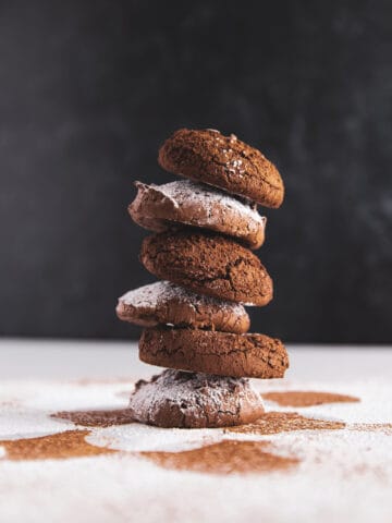 A stack of 6 fudgy chocolate cookies.