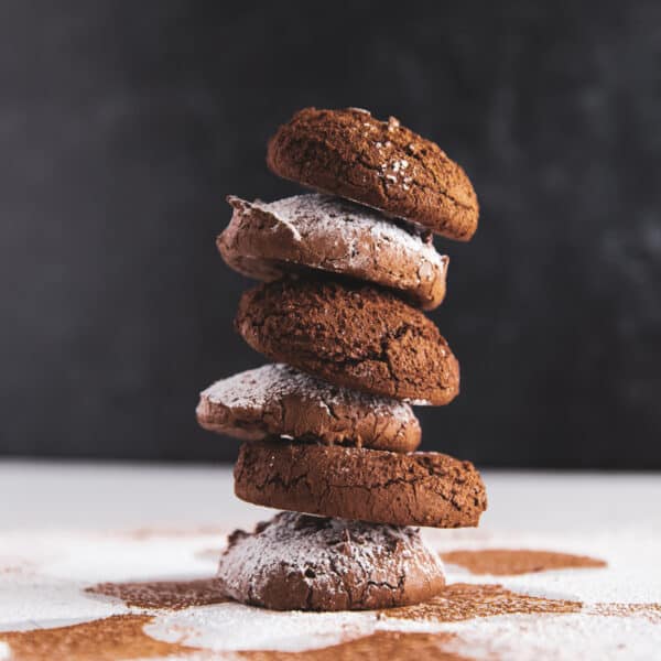 A stack of 6 fudgy chocolate cookies.