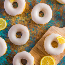 Lemon glazed donuts with slices of lemons