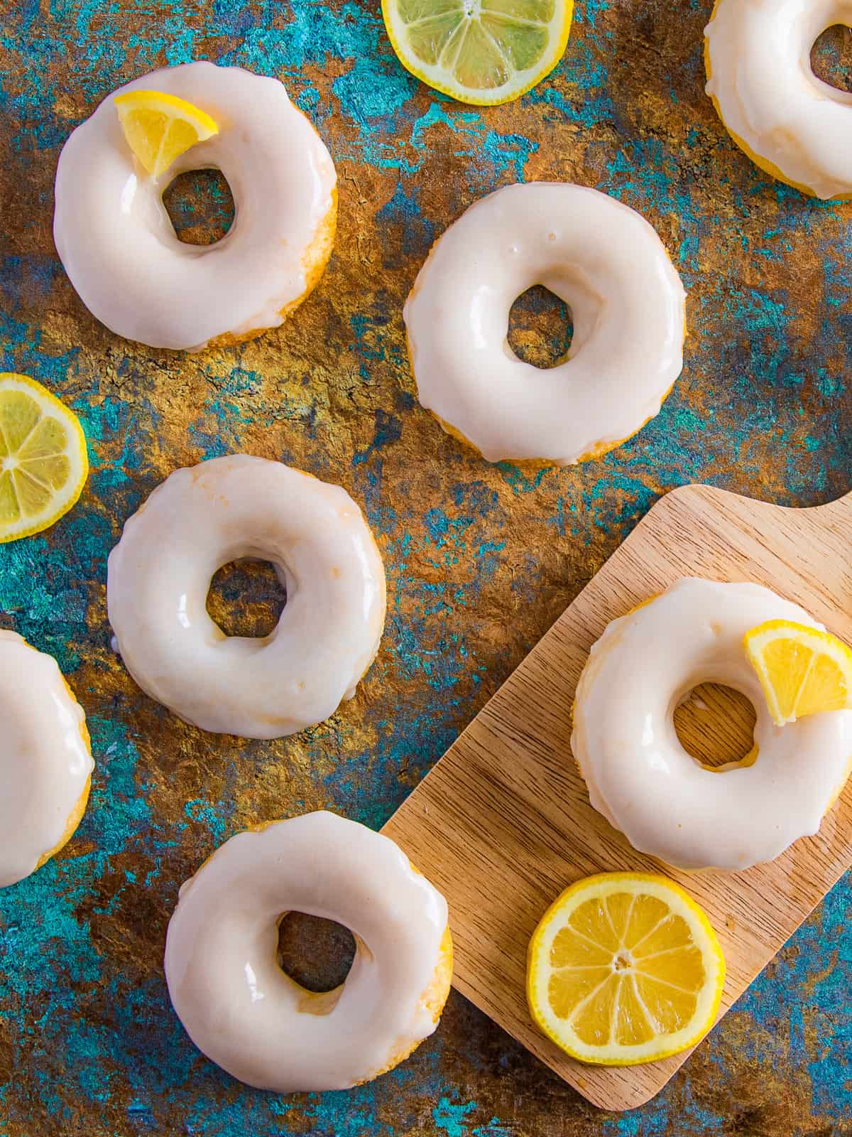 Lemon glazed donuts with slices of lemons