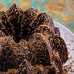 Baked chocolate pound cake topped with grated milk chocolate.