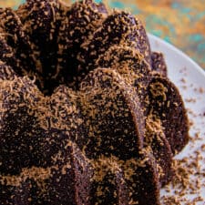 Baked chocolate pound cake topped with grated milk chocolate.