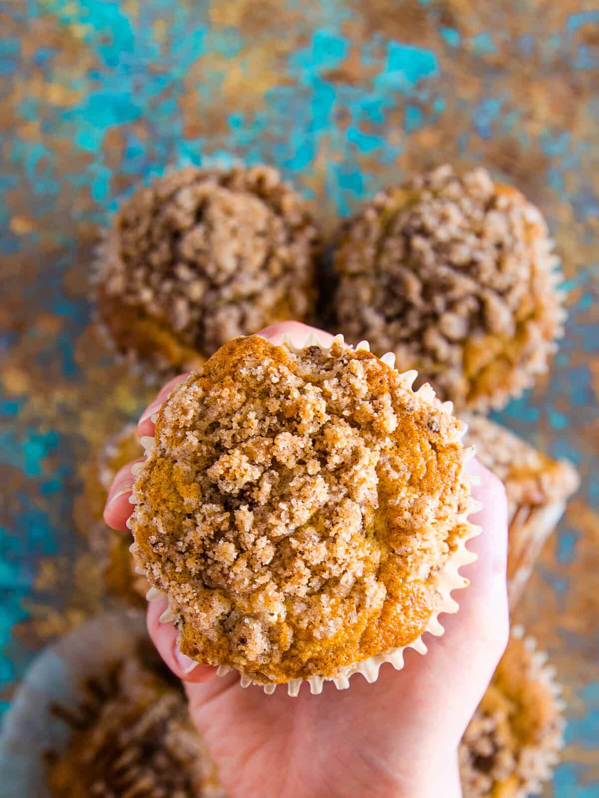 Close up of a cinnamon streusel muffin.