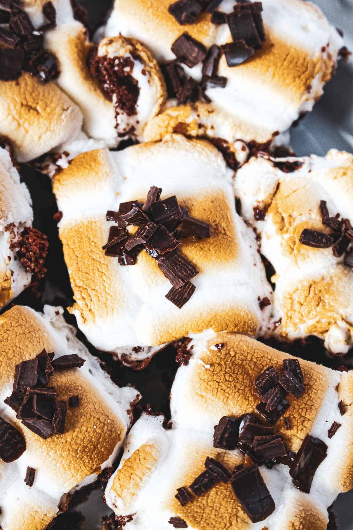 A close up of s'mores brownies with chocolate shavings.